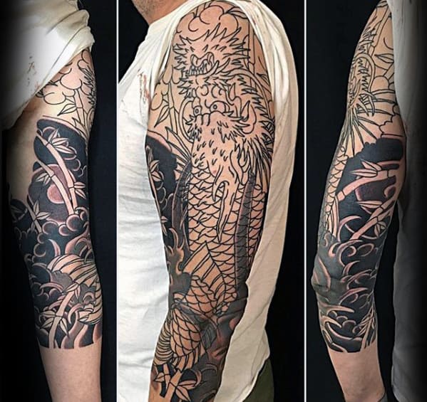 Man With Tattoo Of Koi Dragon Half Sleeve Design