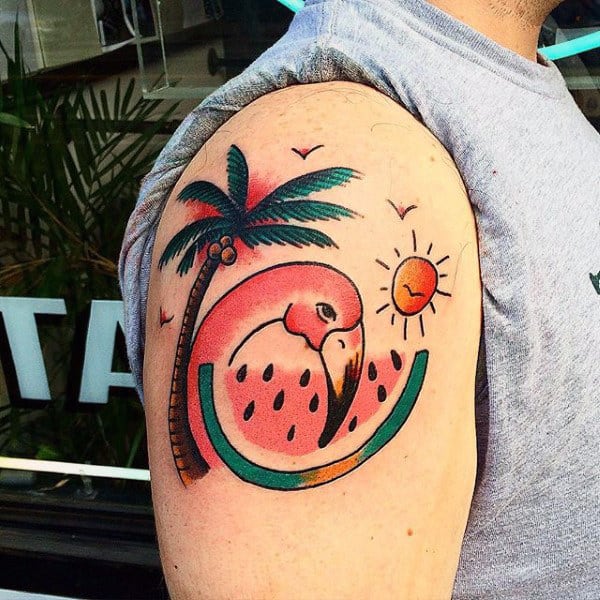 Man With Traditional Palm Tree And Fruit Tattoo On Upper Arms