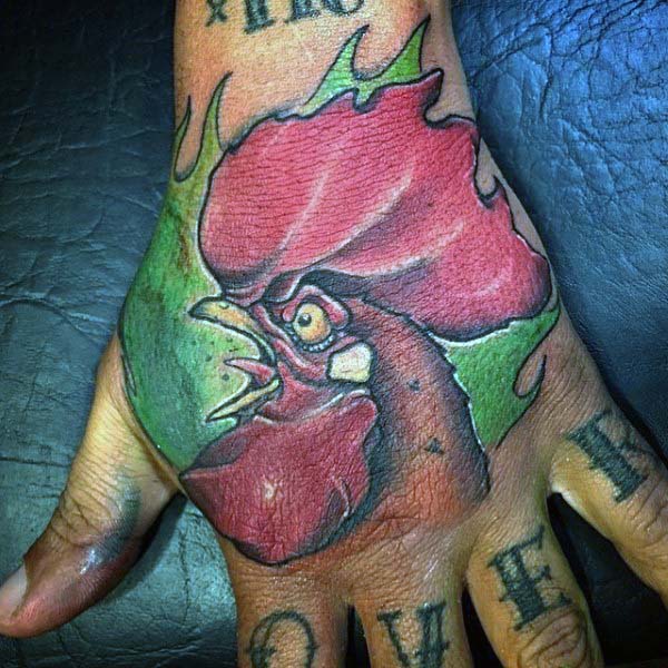 Man With Traditional Style Rooster Tattoo On Hand