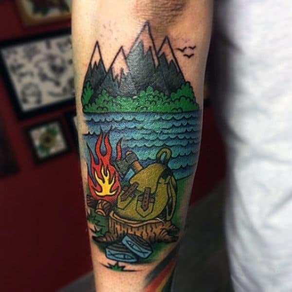 Man With Travel Camping Themed Forearm Tattoo