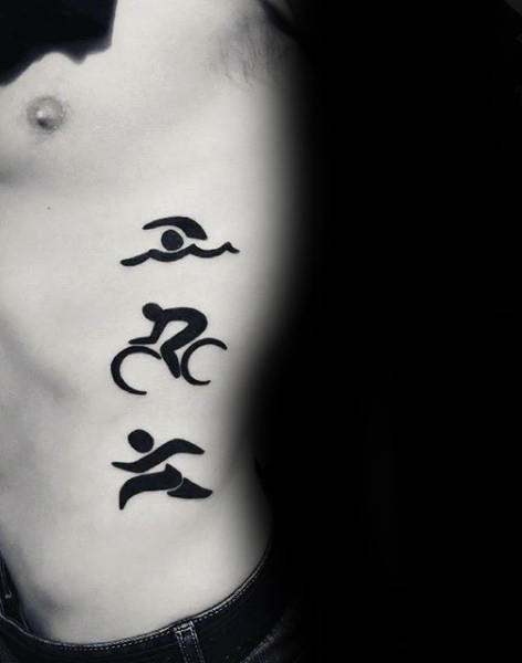 Man With Triathlon Running Symbols On Ribs Tattoo