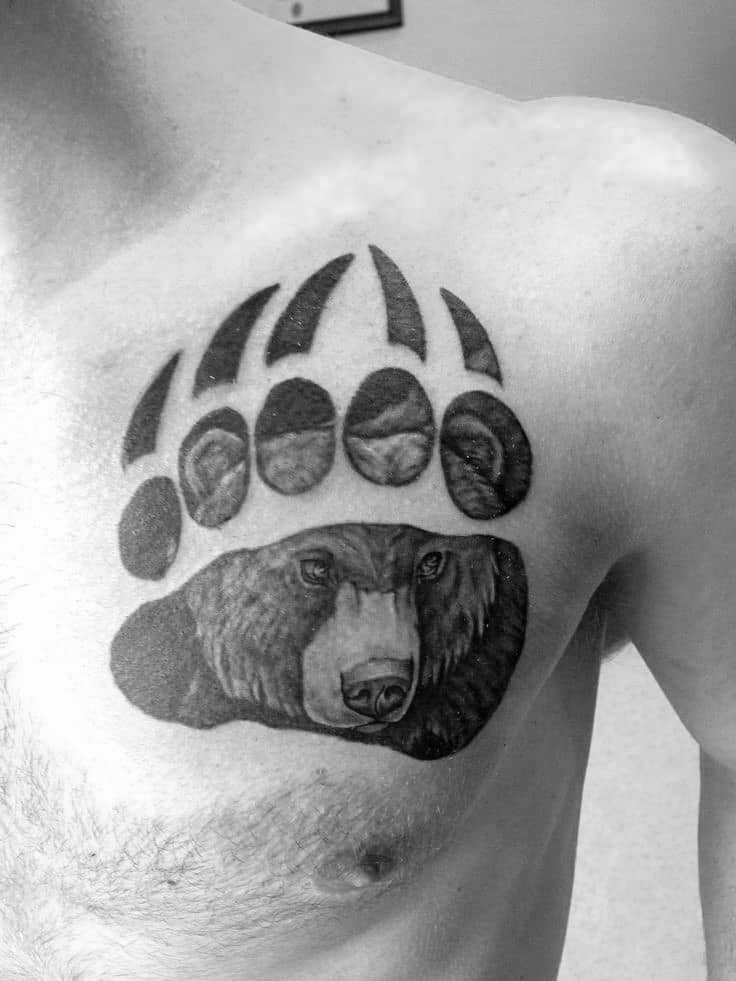 Man With Upper Chest Tattoo Of Bear Claw