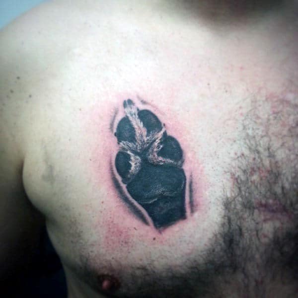 Man With Upper Chest Tattoo Of Realistic Dog Paw Design
