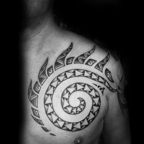Man With Upper Chest Tattoo Of Tribal Sun
