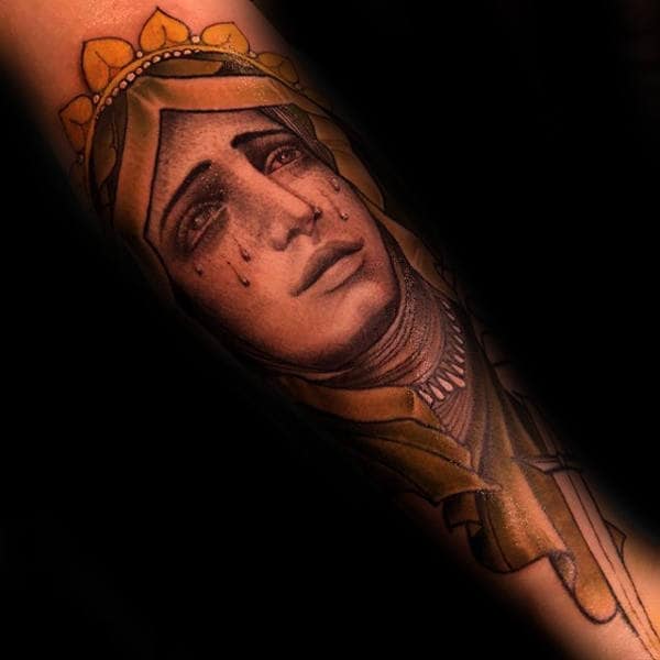 Man With Virgin Mary Neo Traditional Tattoo On Forearm.