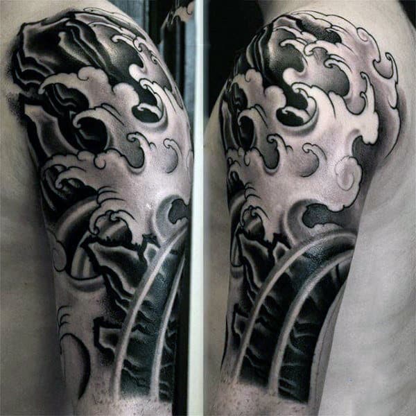 Man With Wave Tattoo Sleeve In Black Ink