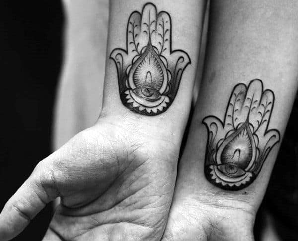 Man With Wrist Tattoos Hamsa Design