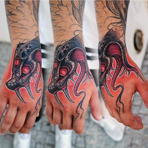 Man With Traditional Snake Tattoos On Hands