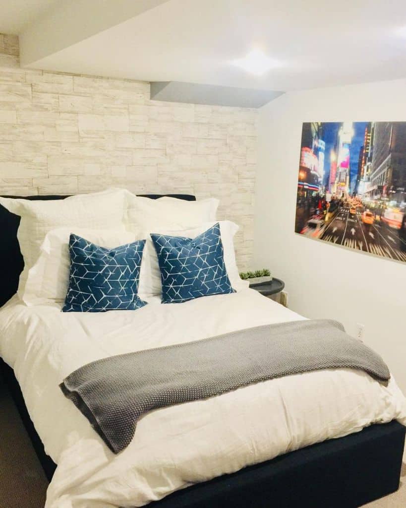 small bedroom with wall art