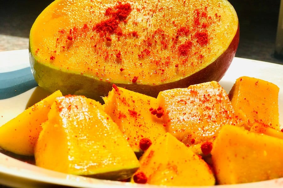 mango slice with red chili powder