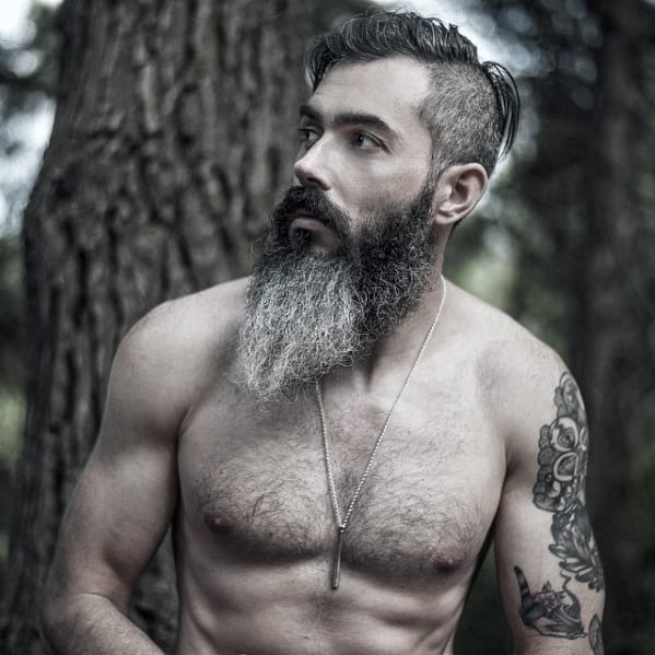 Long beard with grey hair on a shirtless man