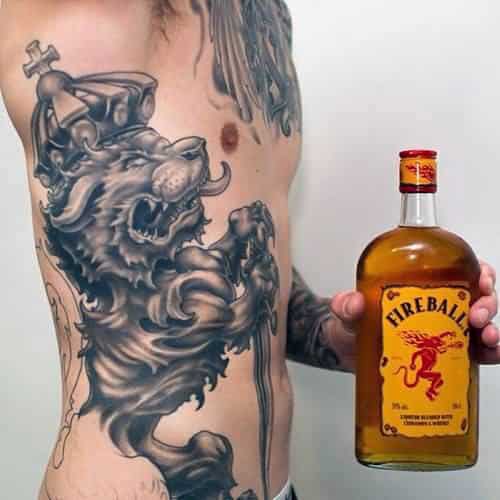 Manly Guys Lion With Crown Rib Cage Side Tattoo Ideas