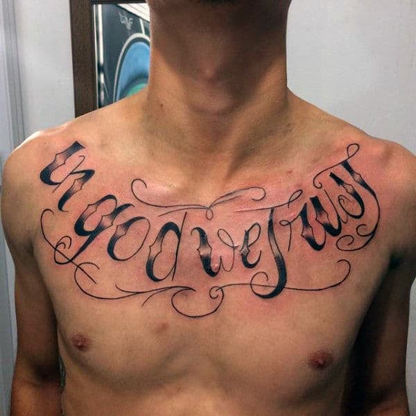 Manly Lettering Male In God We Trust Word Upper Chest Tattoo Design Ideas.