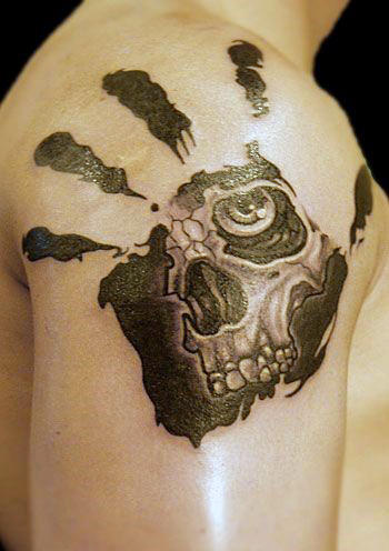 Manly Skull Handprint Shoulder Tattoo On Male