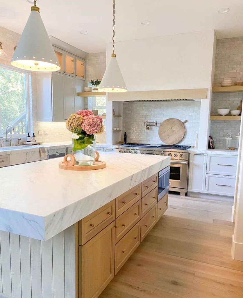 country style kitchen white and wood stained cabinets thick white marble countertop 