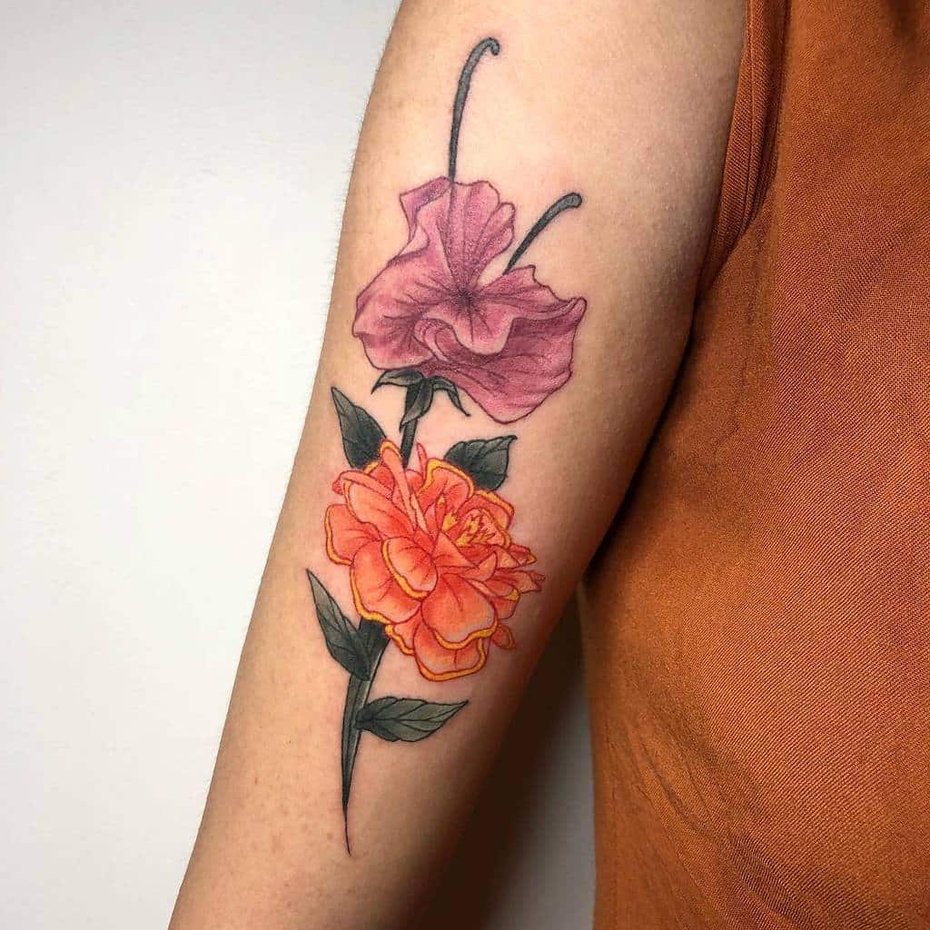 marigold and cosmos flower arm tattooTikTok Search
