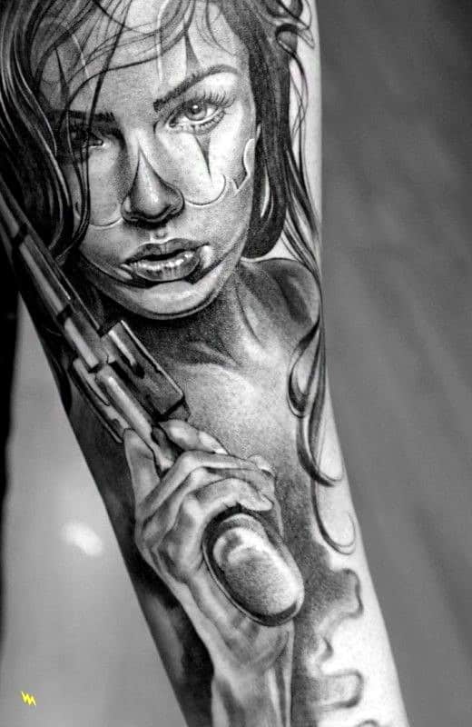 Masculine Chicano Female With Pistol Male Inner Forearm Tattoos