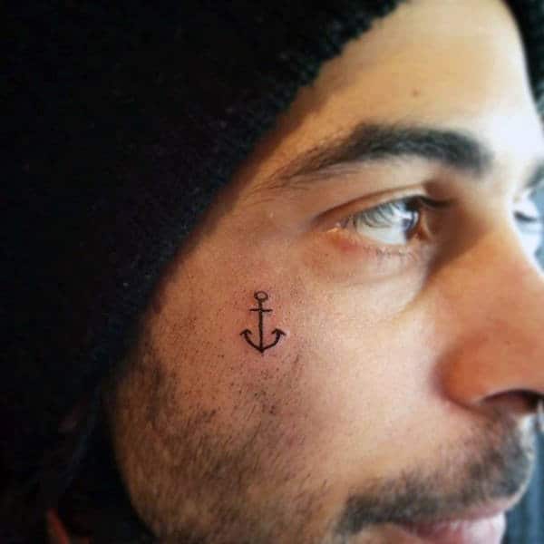 Masculine Guys Simple Anchor Tattoo On Face