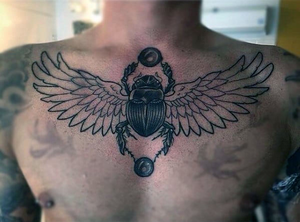 masculine male upper chest scarab tattoo