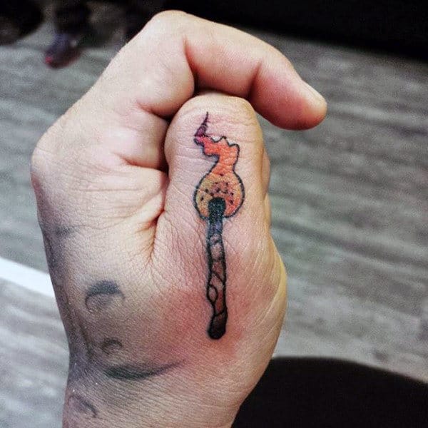 Match On Fire Male Finger Tattoo On Thumb