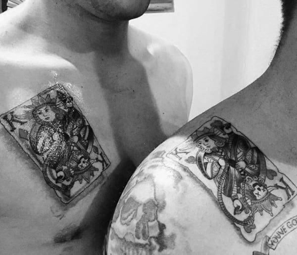 matching brother tattoos of king playing card for guys on chest and shoulder