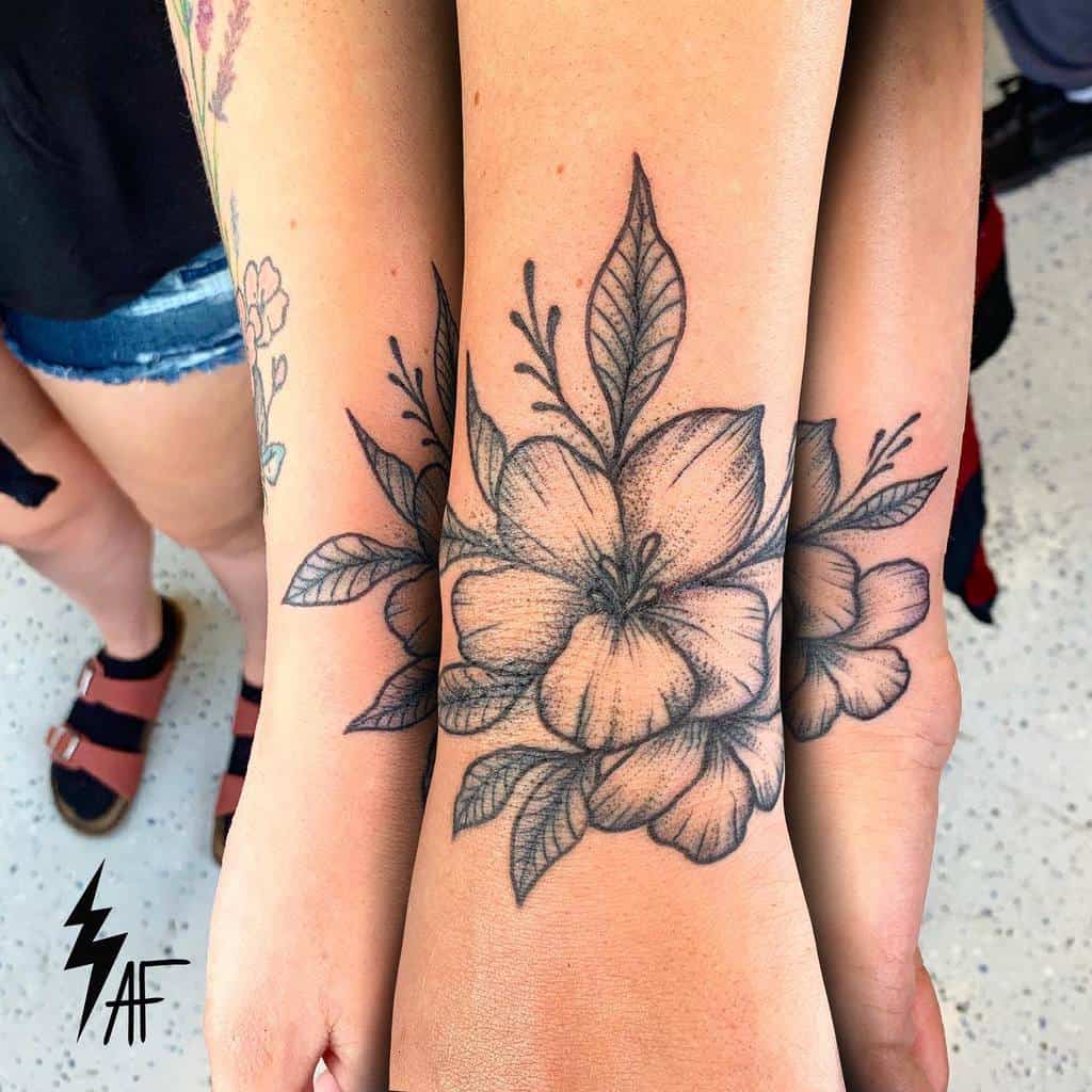 matching flower wrist tattoo adammadethat.tattoo