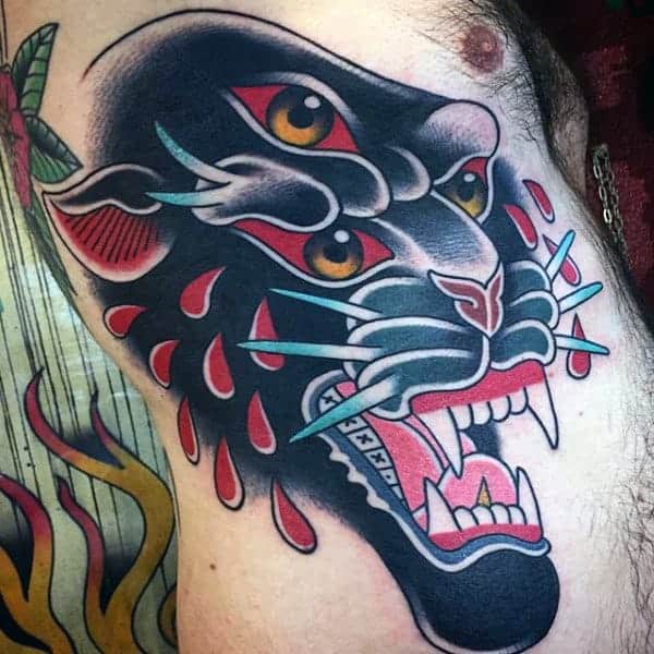 men-side-rib-roaring-three-eyed-feline-tattoo