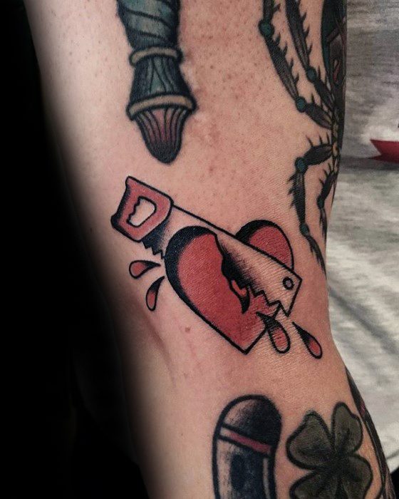 Mens Awesome Saw Through Heart Filler Tattoo Ideas