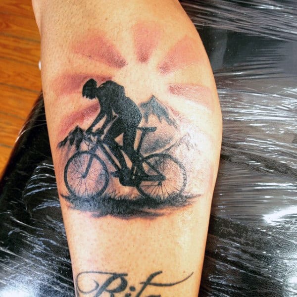 Mens Bicycle Riding At Sunset Tattoo On Calves