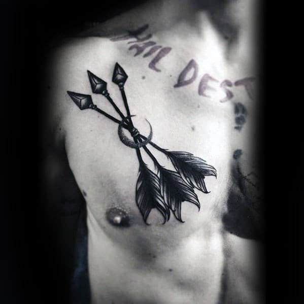 mens-black-and-grey-ink-moon-with-arrows-traditional-chest-tattoo