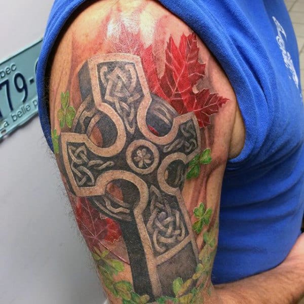 Mens Celtic Cross Stone Tattoo With Red Leaves On Upper Arm