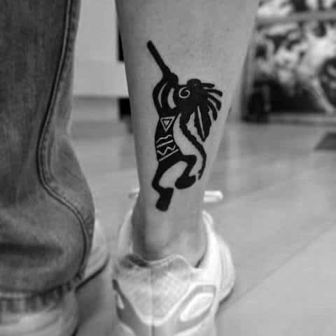 Mens Cool Kokopelli Tattoo Ideas On Lower Back Of Leg