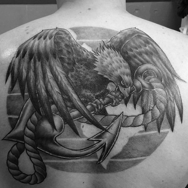 Black shaded and outlined globe eagle and anchor tattoo on left chest for  men