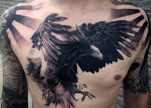 Black and grey eagle tattoo on the right chest.