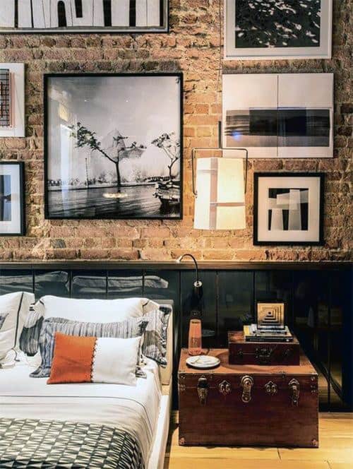 exposed brick bedroom platform bed chest table