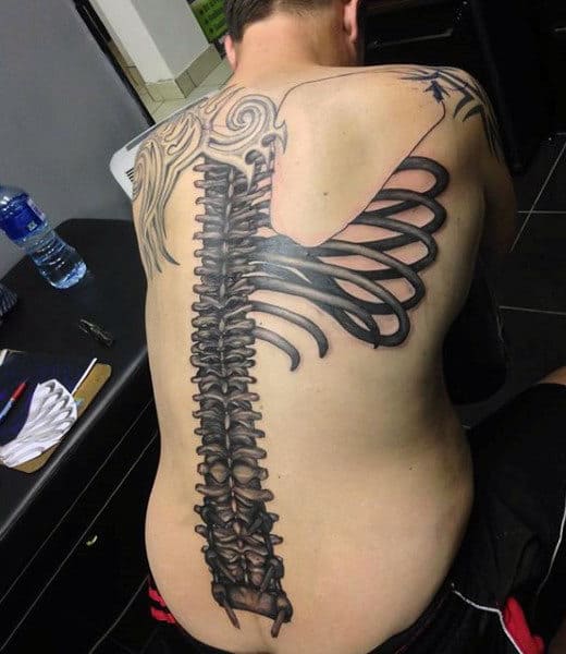 Mens Middle Of Back Spine Bone Tattoo Design