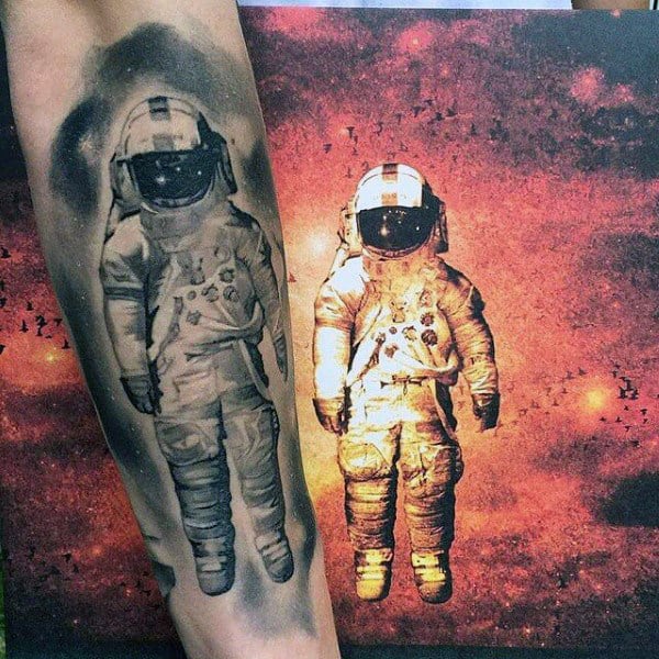 Mens Modern Tattoo Of Shaded Astronaut On Forearm