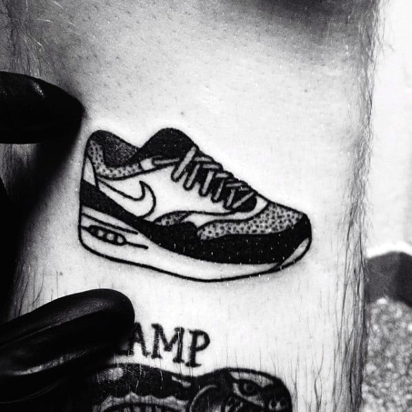 Mens Old School Simple Traditional Black Ink Nike Shoe Tattoo On Leg