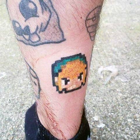 Mens Pixalated Zelda Face Small Tattoo On Leg