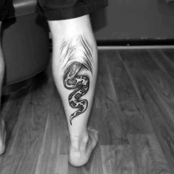 Mens Ripping Skin Tattoo Of Snake On Back Of Leg Calf