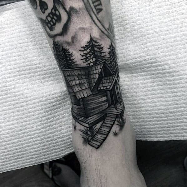 Mens Shaded Black And Grey Cabin Tattoo On Leg