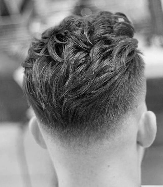 Mens Short Wavy Hairsyle With Low Fade