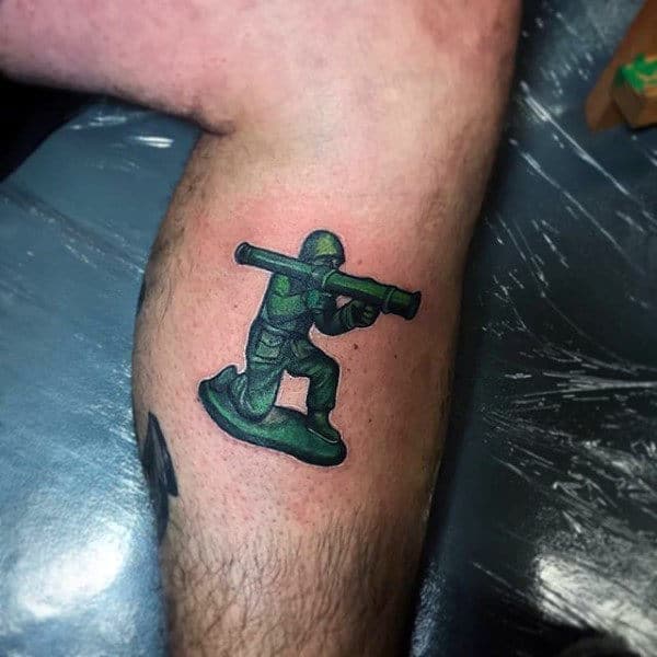 mens-small-badass-tattoos-green-army-toy-soilder-figure-on-leg-calf