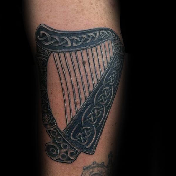 Mens Tattoo Ideas With Harp Design Celtic Arm