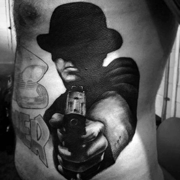 Mens Tattoo Ideas With Incredible 3d Design Of Man Holding Pistol On Rib Cage Side