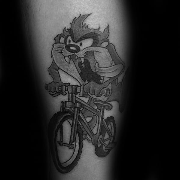 Mens Tattoo Ideas With Tasmanian Devil On Bicycle Design Forearm