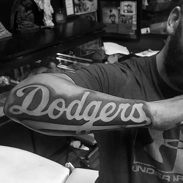 Mens Tattoo With Dodgers Design Script On Outer Forearm Negative Space