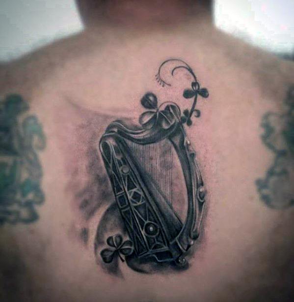 Mens Tattoo With Harp Design Upper Back