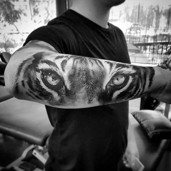 Mens Tattoo With Tiger Eyes Design Outer Forearm