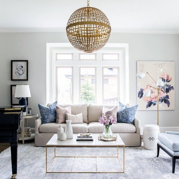 small elegant living room with gray sofa and gold coffee table